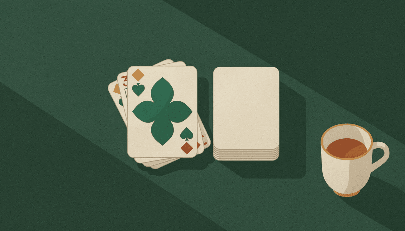 A discard pile with a green club card on top, a face-down draw pile, and a cup on a green table